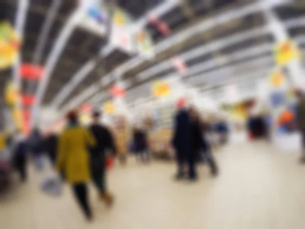 Pessoas fazendo compras em loja de departamento tema borrão fundo — Fotografia de Stock