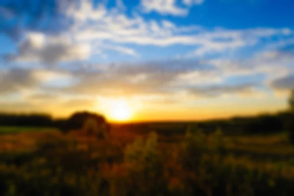 Sunset over green fields — Stock Photo, Image