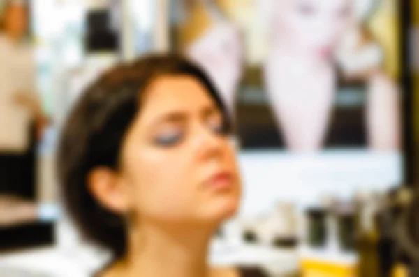 Maquiagem artista e modelo tema borrão fundo — Fotografia de Stock
