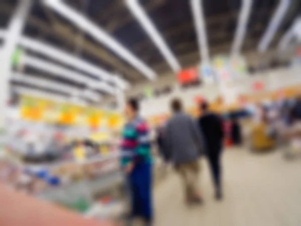 Pessoas fazendo compras em loja de departamento tema borrão fundo — Fotografia de Stock