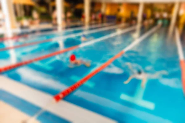 Svømning konkurrence tema sløre baggrunden - Stock-foto