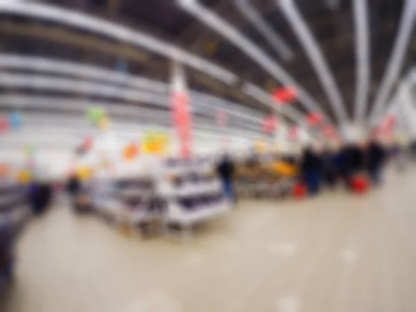 Gente comprando en grandes almacenes tema desenfoque fondo — Foto de Stock