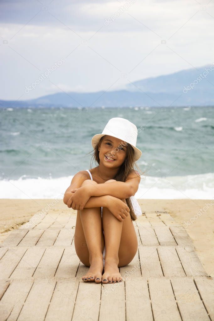 A beautiful girl on a sandy beach