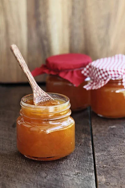 Wooden Spoon Homemade Jar Cantaloupe Jam Two Other Jars Background — Stock Photo, Image
