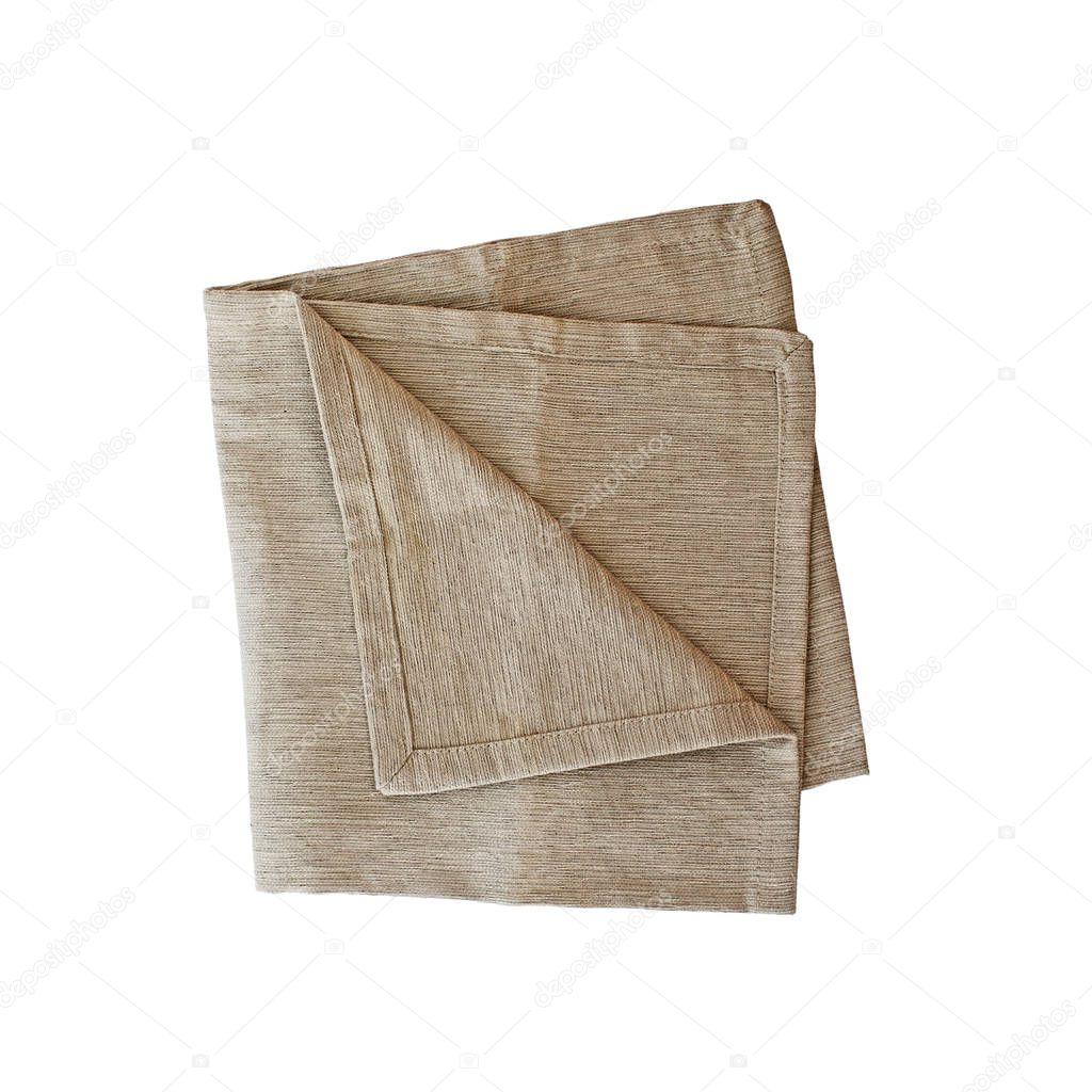 Folded linen napkin isolated over a white background with clipping path included. Image shot from overhead.
