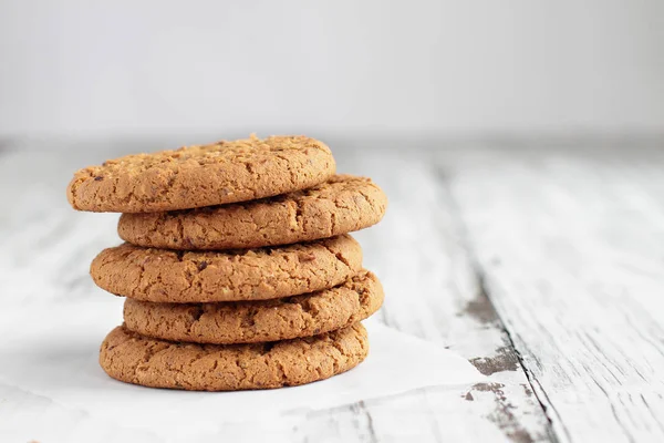 Delicious Stack of Oatmeal cookies with glass of milk — Stock Photo, Image