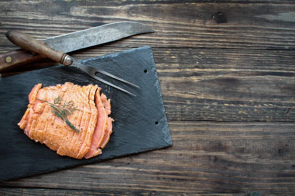 Smoked Salmon over Rustic Wood Background Table