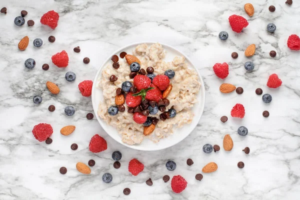 Bowl of Oatmeal with Raspberries and Blueberries — Stock Photo, Image