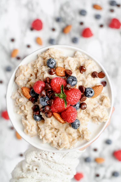 Woman Holding a Bowl of Oatmeal in One Hand — Stock Photo, Image