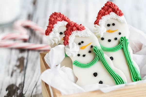 Iced Christmas Snowman Cookies Biscuits Carrot Nose Santa Hat Scraft — Stock Photo, Image