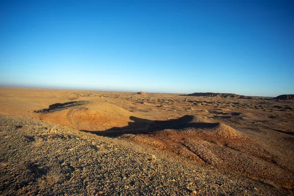 Golden deserts and hills at sunrise. — Stock Photo, Image