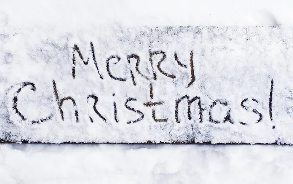 Written text Merry christmas on the snow