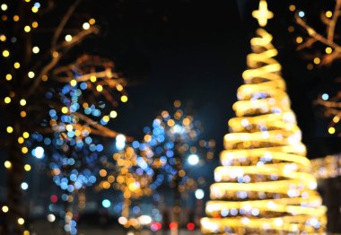 Noel dekorasyon arka plan ile parlayan altın ve mavi ışıklar