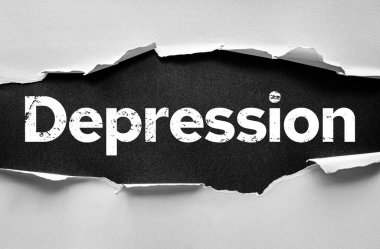Depresyon kelimesini dokulu bir arka planda gösteren yırtık bir kağıt. Zihinsel sağlık mücadelelerini, duygusal acıyı, psikolojik hastalığı ve tedavi bilincini sembolize eden kavramsal görüntü