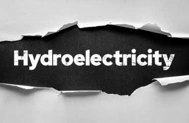 Hidroelektrik sözcüğünün ortaya çıkarıldığı kağıt tasarımı yenilenebilir enerji, su enerjisi, temiz elektrik üretimi, sürdürülebilirlik ve alternatif enerji çözümlerini sembolize ediyor.