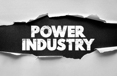 Yırtık kağıt arkaplanda Power Industry metni. Enerji sektörü, elektrik, kamu hizmetleri, altyapı, yenilenebilir kaynaklar ve küresel sanayi büyümesi kavramı