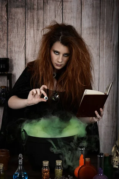 witch with spell book and an eye