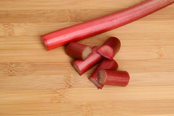 Cut Rhubarb Bamboo Cutting Board — Stock Photo, Image