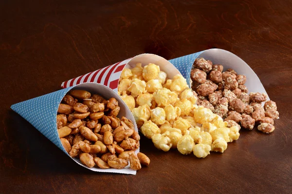 Honey Peanuts Caramel Popcorn Honey Sesame Seed Almonds Paper Cones — Stock Photo, Image