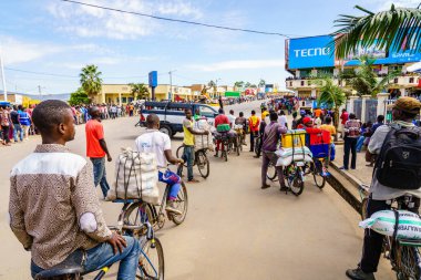 Muhanga, Rwanda, February 26, 2019: People are gathered to watch Tour Du Rwanda cycling race in the city of Muhanga, Rwanda clipart