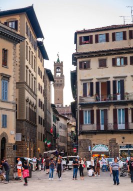 View of the Arnolfos tower of Palazzo Vecchio from Piazza di Santa Croce in Florence, Italy clipart