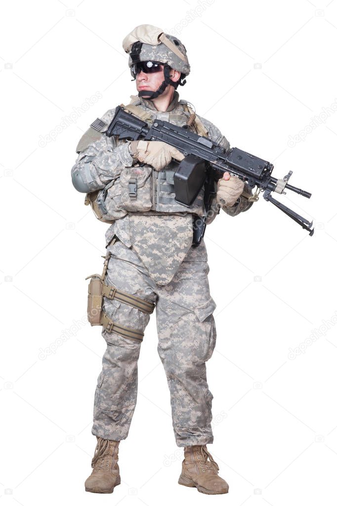 Full equipped US marine standing with machine gun