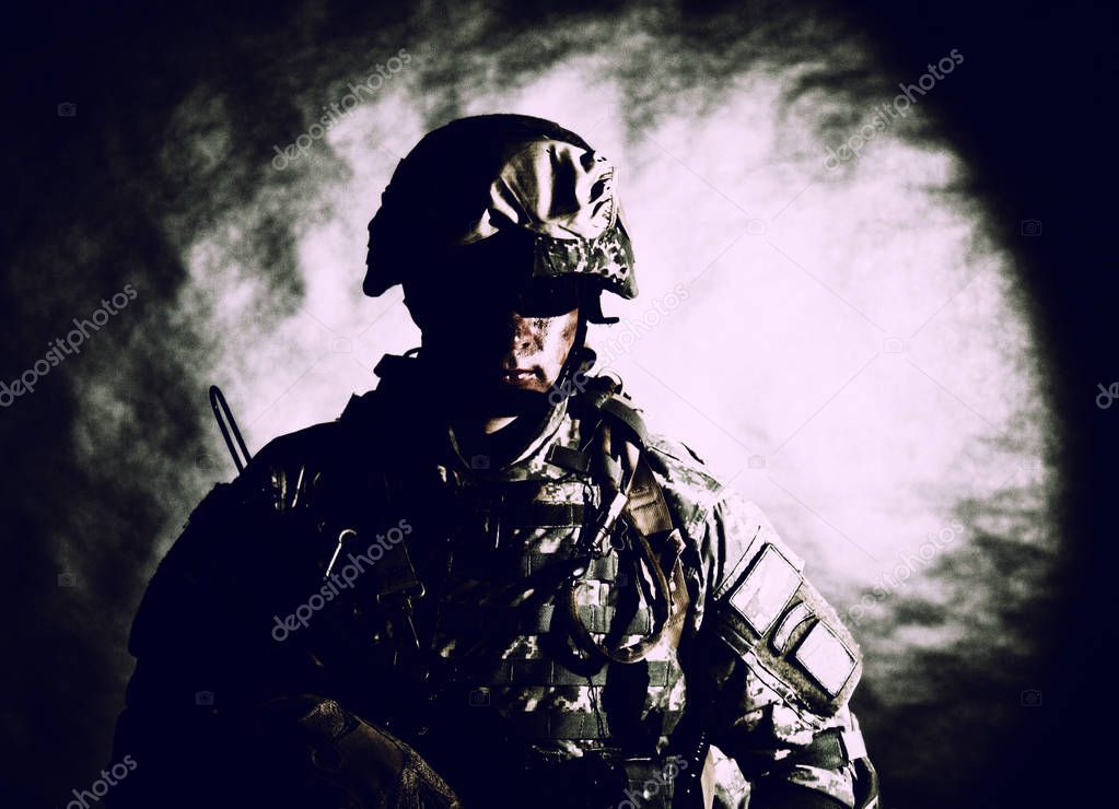 Soldier of special forces with assault rifle