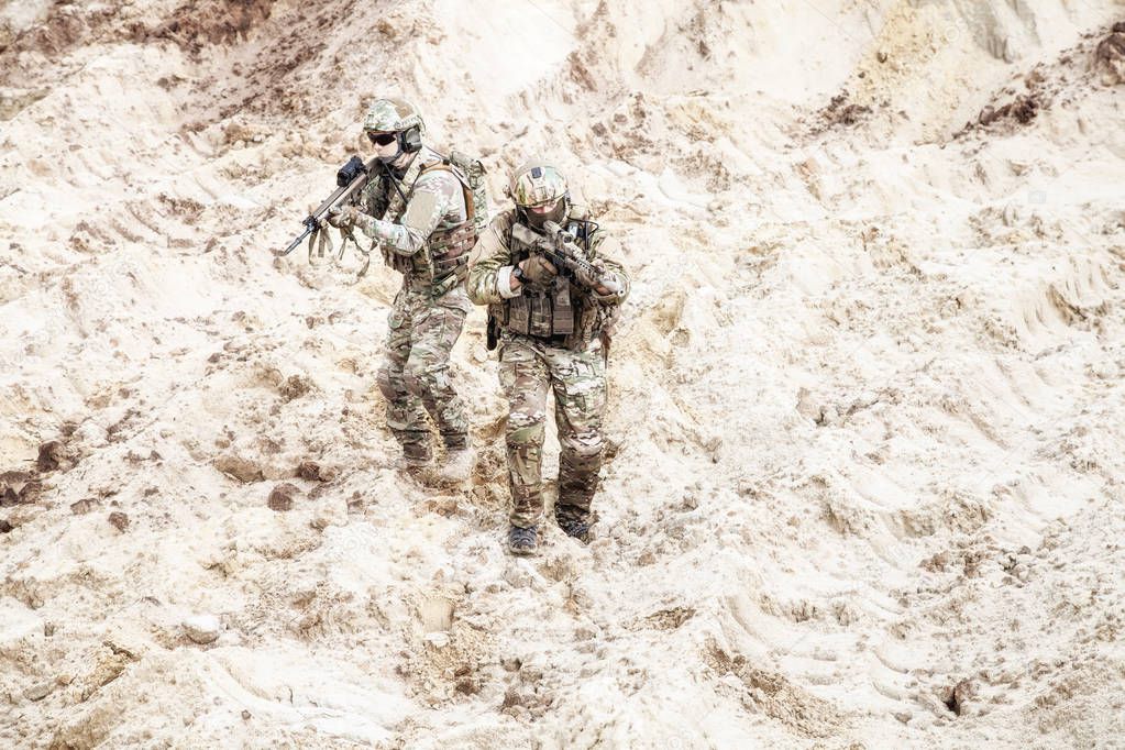 Infantrymen ready for fight moving in desert