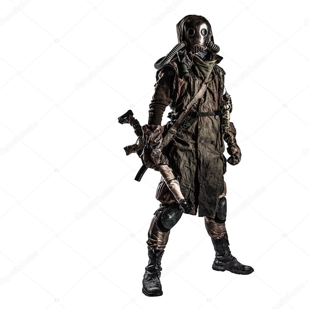 Post apocalyptic creature in gas mask armed by gun
