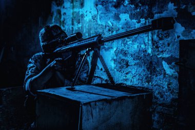 Army sniper firing with 50 caliber rifle at night clipart
