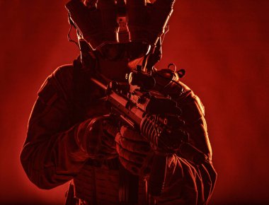 Elite soldier with modern armament studio shoot