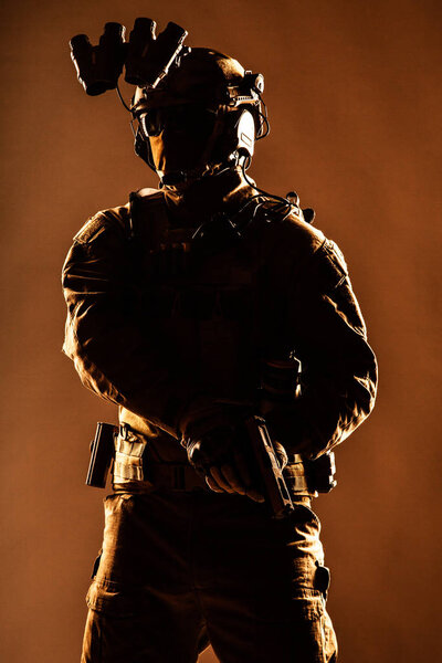 Elite forces soldier armed with service pistol