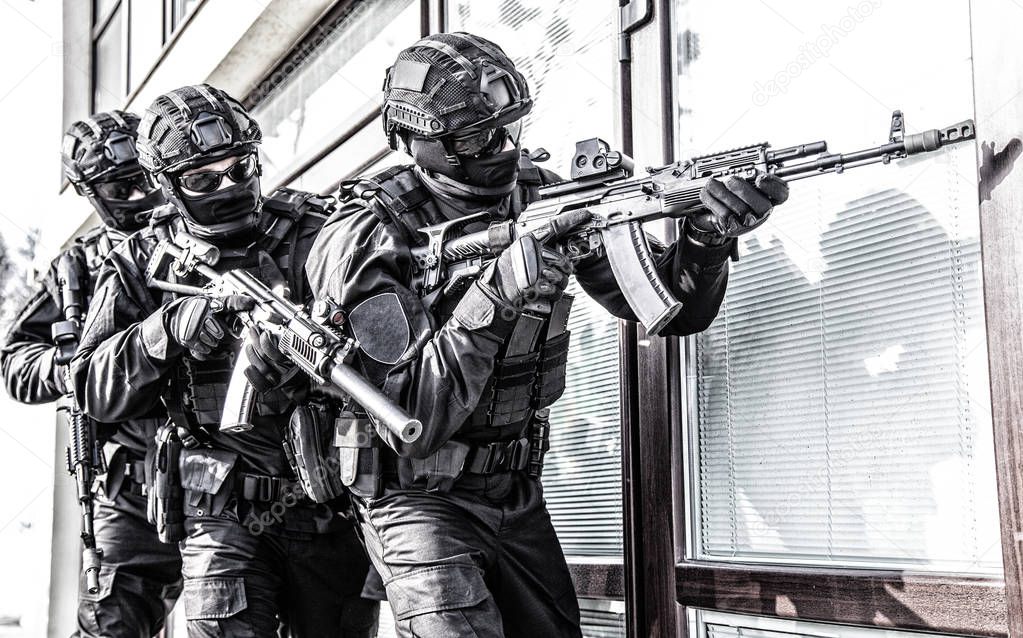 Police counter terrorist team squad storming building