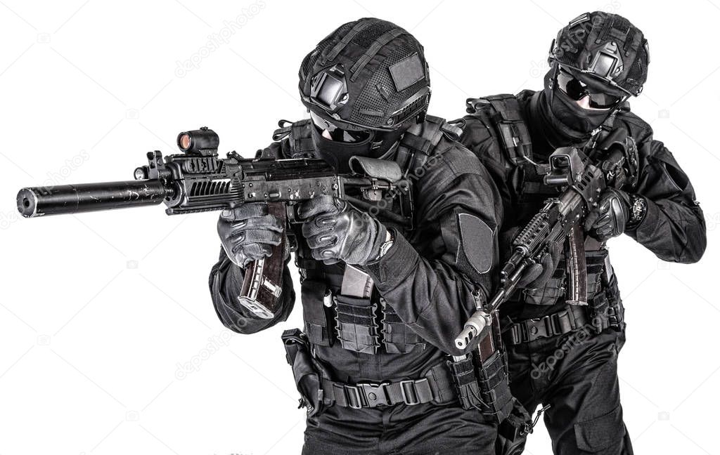 Police elite squad fighters protecting each other