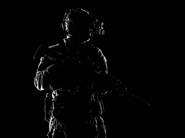 Special forces fighter in darkness studio shoot