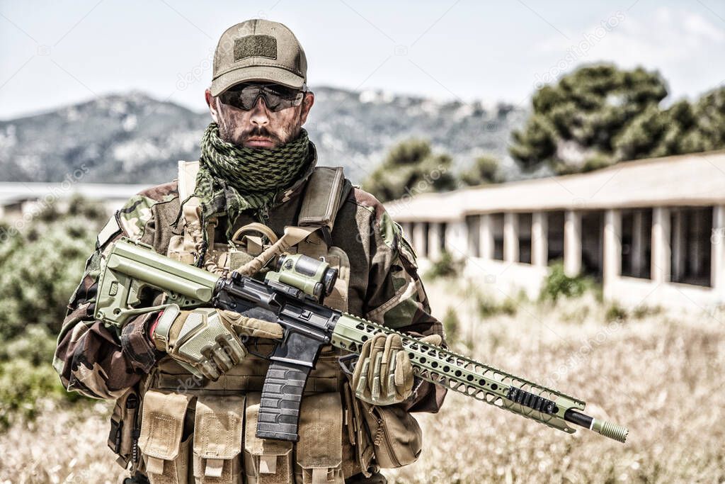 Private military company mercenary with gun
