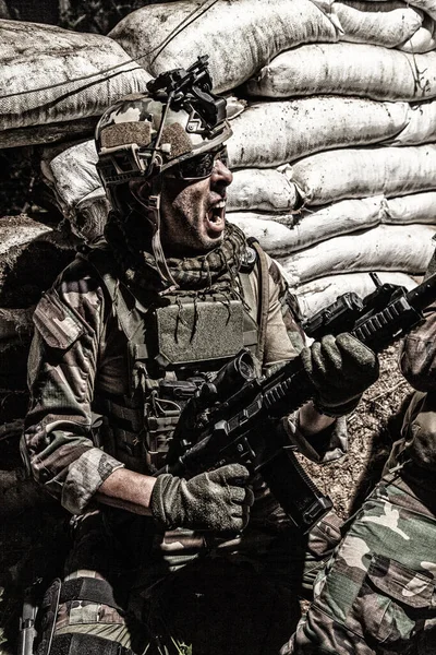 Navy SEAL shooter fighting at night in trench — Stok Foto