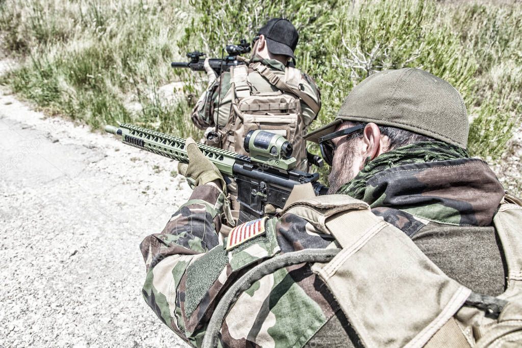 Navy SEALs team shooters making ambush on road