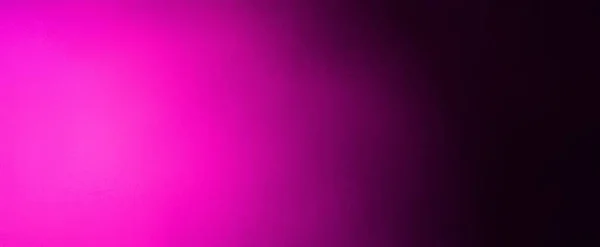 Hot pink abstract background with gradient bright pink spotlight on black blurred texture