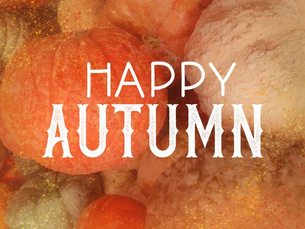 Happy Autumn in white typography letters on slightly blurred and textured orange pumpkins and gourds, fall festival or autumn harvest party graphic art design