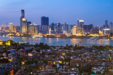 skyline of xiamen in China at night clipart