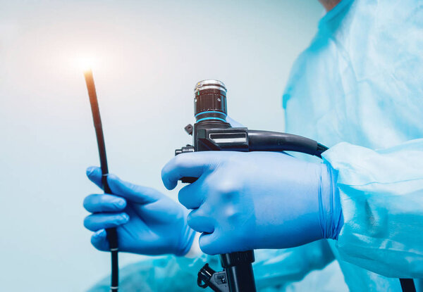 Doctor holding endoscope before gastroscopy