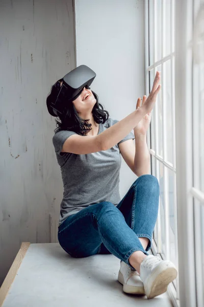 Young Girl Wearing Virtual Reality Goggles Sitting Window — Stock Photo, Image