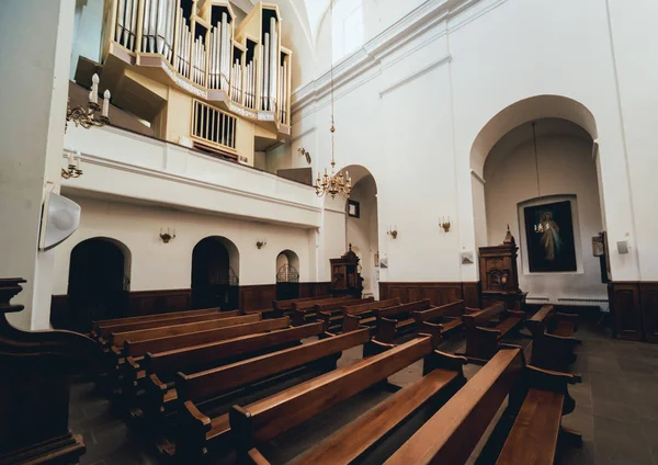Interior view of a old church with empty pews. Background