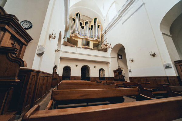 Interior view of a old church with empty pews. Background