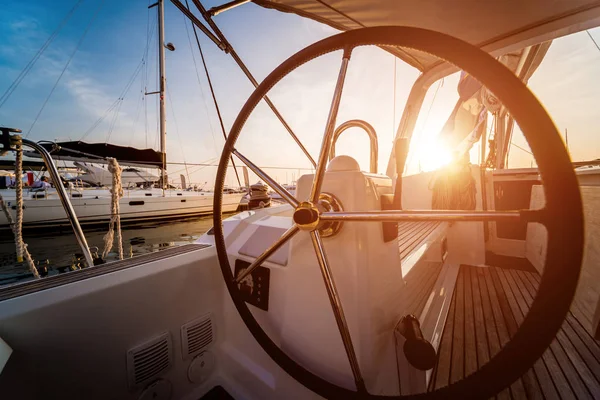 A modern speed boat yacht steering wheels. Background