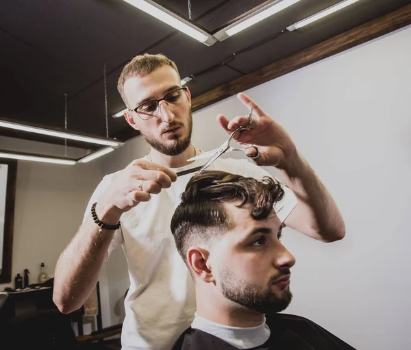 Young Man Trendy Haircut Barber Shop Barber Does Hairstyle Beard — Stock Photo, Image