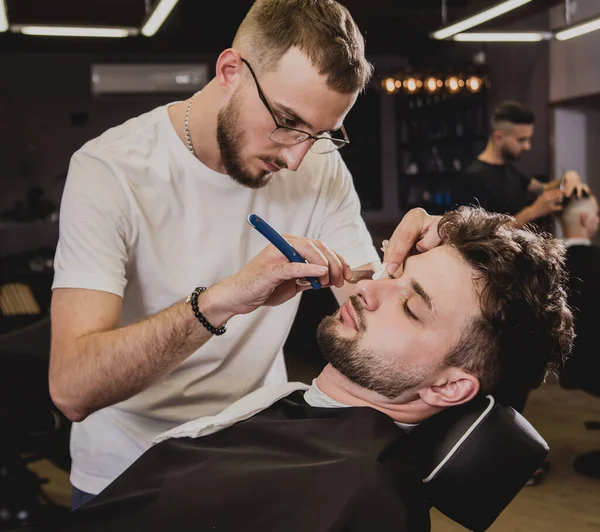 Young Man Trendy Haircut Barber Shop Barber Does Hairstyle Beard — Stock Photo, Image