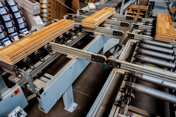 Production line of wooden floor factory, industrial background