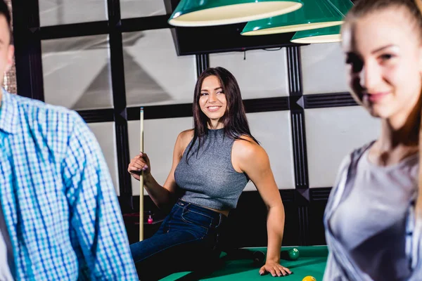 Young Woman Playing Billiard Posing Table Cue Her Hands Group — 스톡 사진
